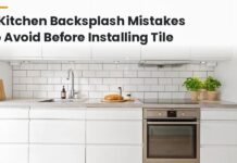 7 Kitchen Backsplash Mistakes to Avoid Before Installing Tile Modern kitchen with white subway tile backsplash, countertop, and wood cabinets